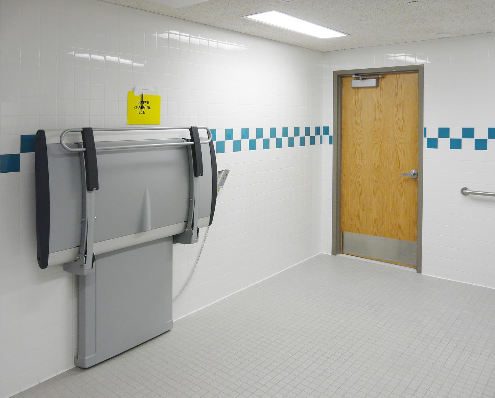 Pressalit SCT 3000 shower and changing table in a school bathroom