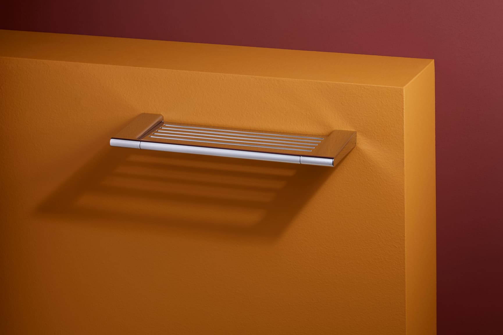 Pressalit STYLE shelf on orange wall
