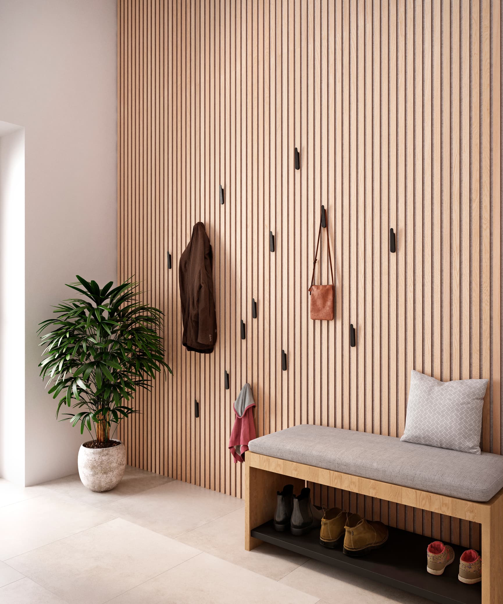 Pressalit STYLE towel hooks, matt black, mounted in hallway