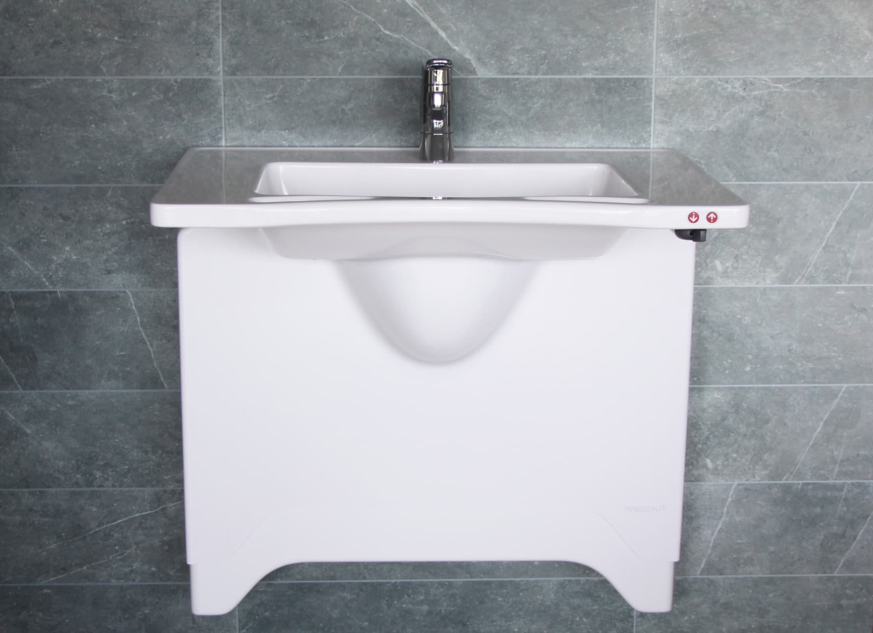 Pressalit sideways adjustable wash basin mounted on wall